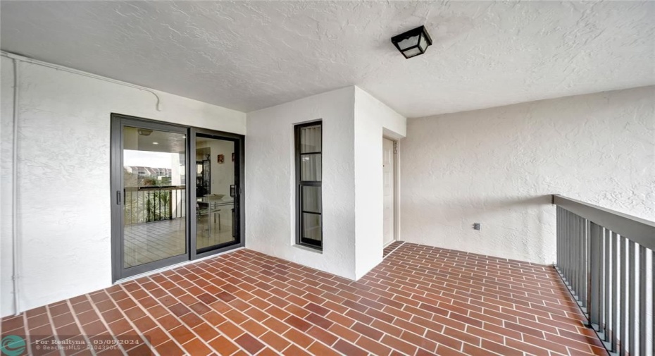Spacious Corner Unit Catwalk and Large Patio Doors to Kitchen