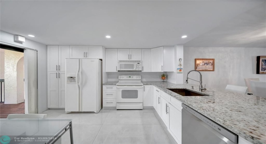 Spacious Open Kitchen with Patio Doors To Catwalk on Left