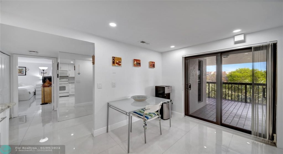 Spacious Kitchen With Patio Doors to Catwalk; Doorway to Guest Bedroom on Left