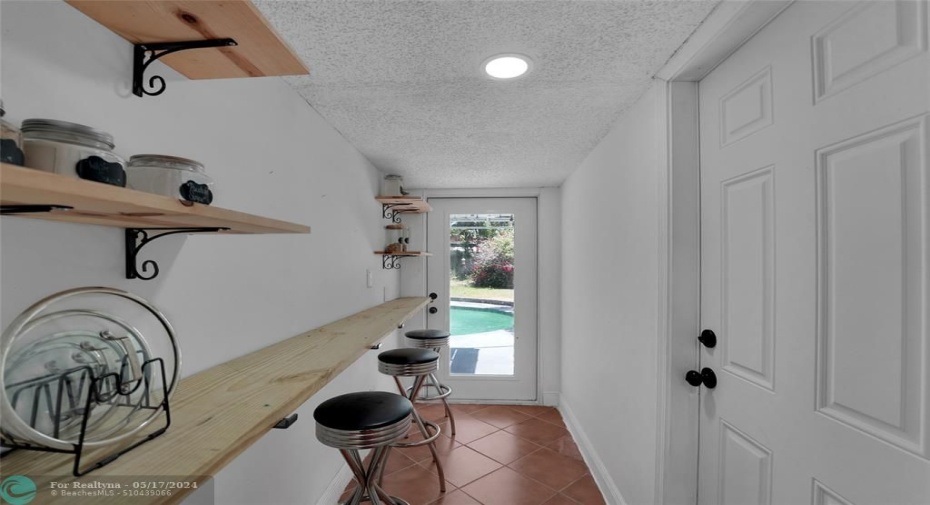 BAR AREA OFF FROM KITCHEN/FOYER TO BACK YARD!
