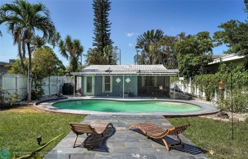 BACK YARD - VIEW OF INVITING POOL & CHASE LOUNGE AREA W/ SLATE FLOORING!