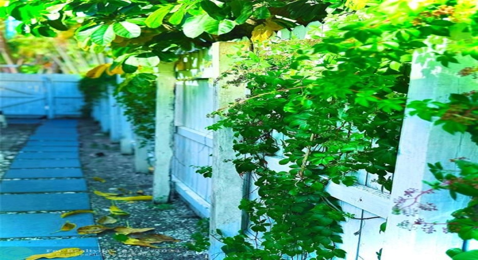 SIDE VIEW - EAST SIDE OF HOME WITH LUSH VEGETATION!