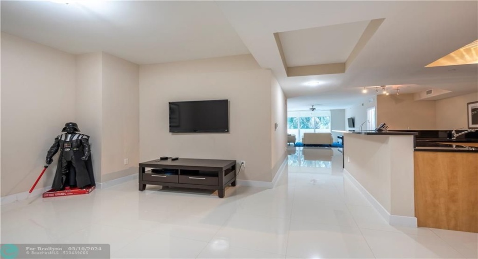 Den to the left, kitchen on the right