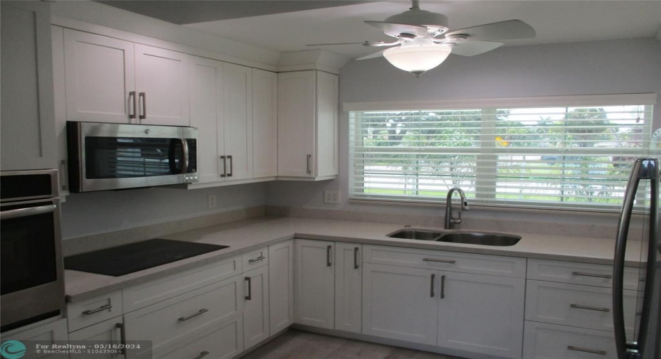 Freshly Painted with Lots of Cabinets.