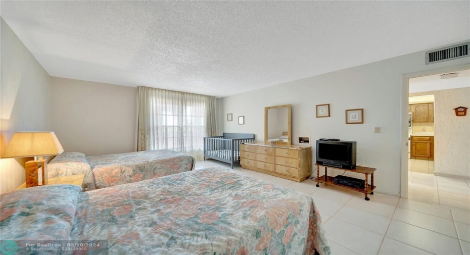 Huge Guest Bedroom and Entrance Into The Kitchen on right.