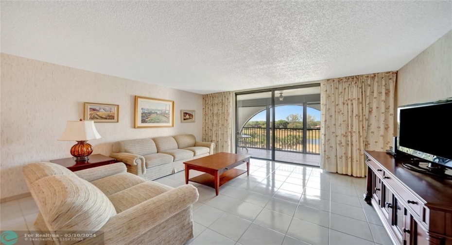 Spacious Living Room with Patio Doors to Large Screened Balcony