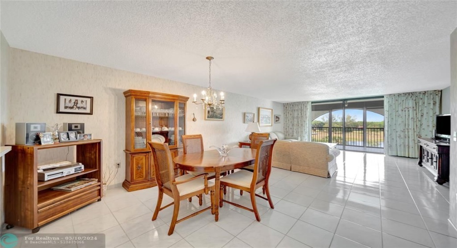 Spacious Living Room & Dining Room with Patio Doors to Screened Balcony