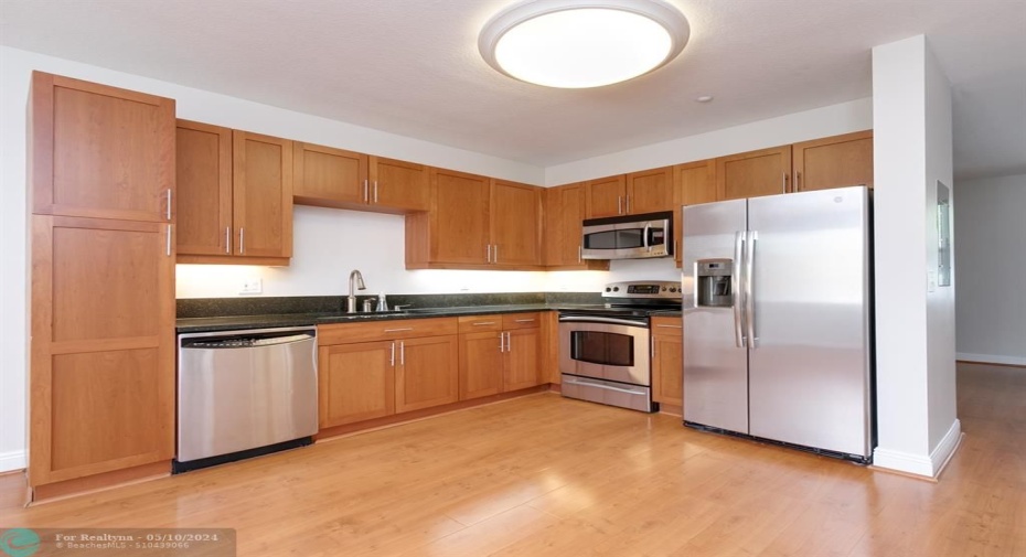 Wood cabinetry, Granite countertops with SS Appliances