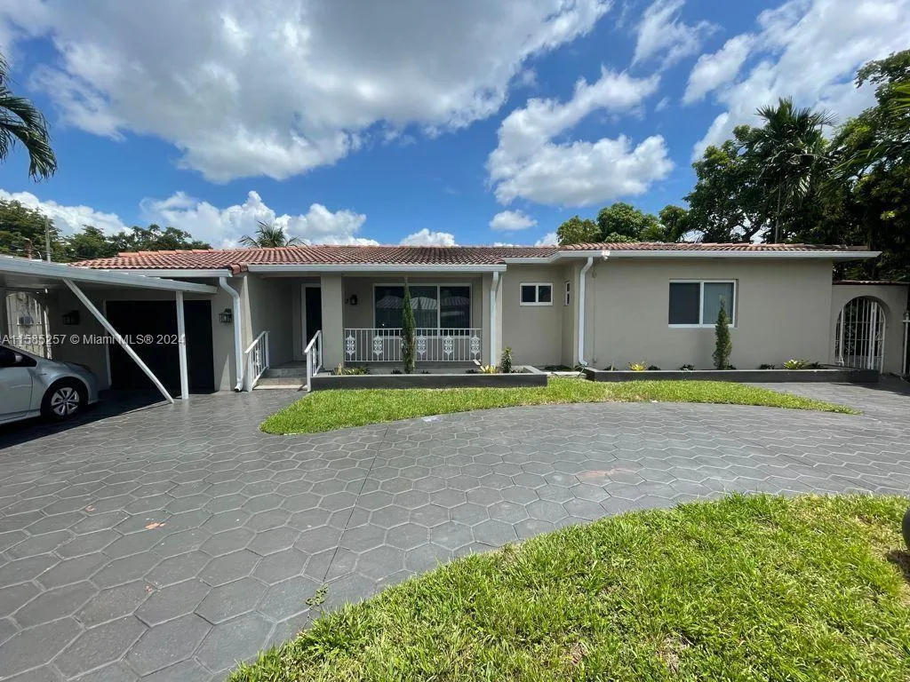 Excellent home in central location.  4 bedrooms/2 baths. Very spacious living areas.  Large backyard with covered patio. Updated. Impact windows. Circular driveway. Gated.