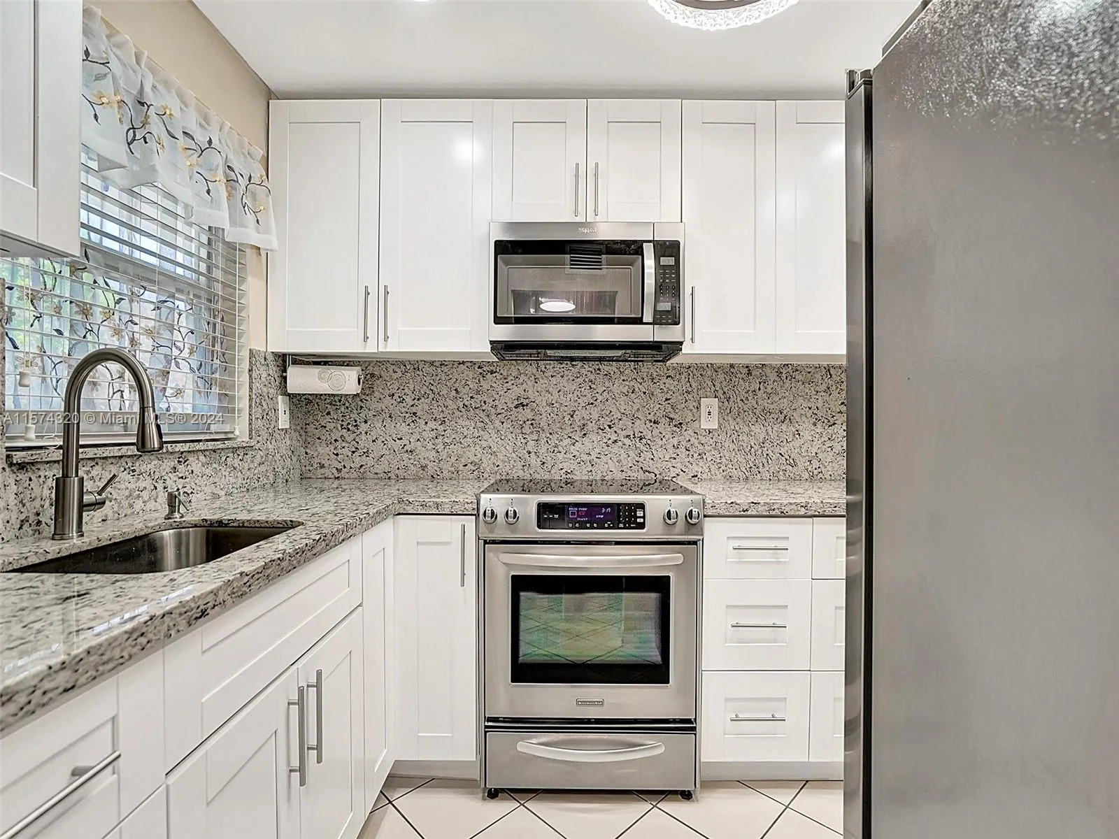 New kitchen with stainless steel applicances
