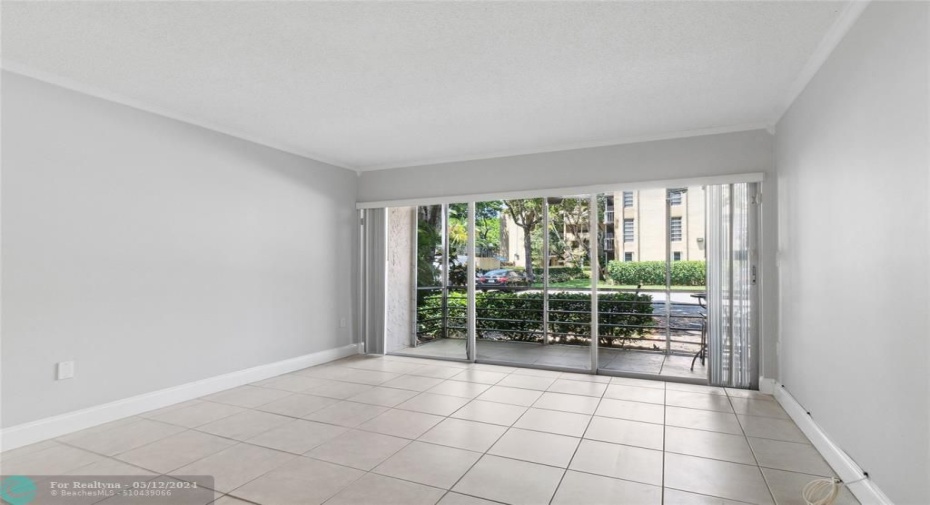 Light and bright living area opens to screened porch