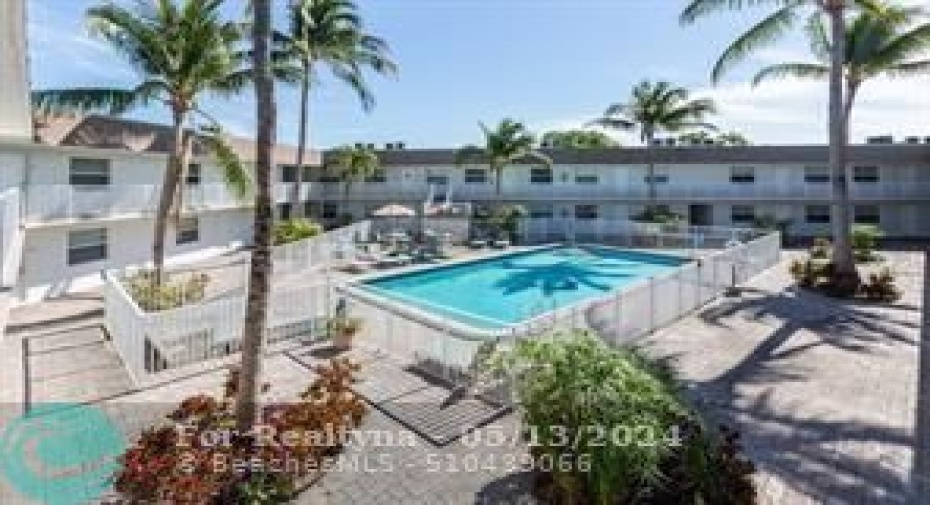 Pool with tropical landscaped courtyard
