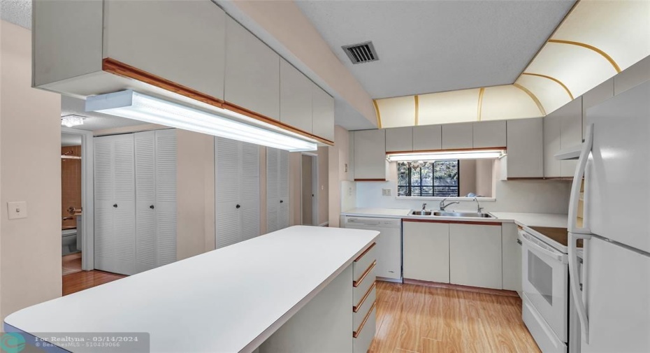 Island with storage above and below with newer appliances