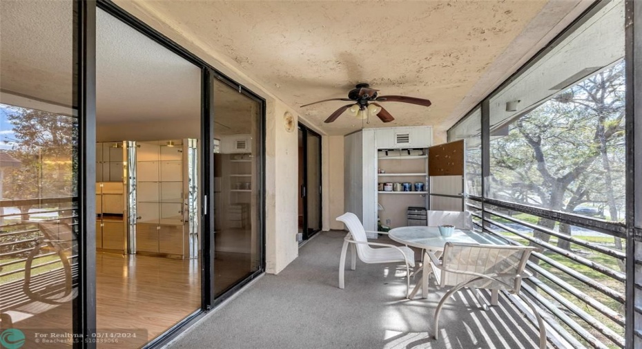 Screened Patio with views of Landscaped Courtyard.Extra Storage cabinet.