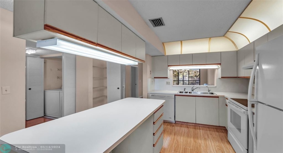 Kitchen looking to Laundry, Guest Bath and Guest Bedroom
