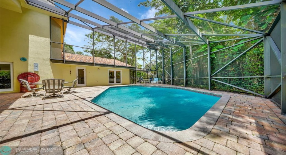 Expansive pool deck perfect for entertaining