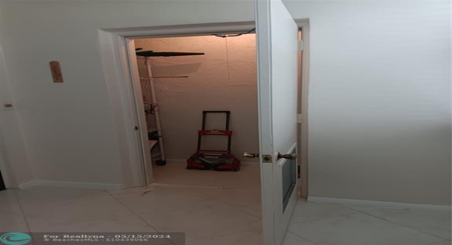 PATIO STORAGE CLOSET WITH ROLLING SHELVES