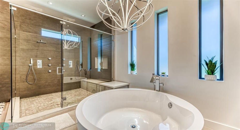 Master bathroom with soaking tub, separate shower and double sink.