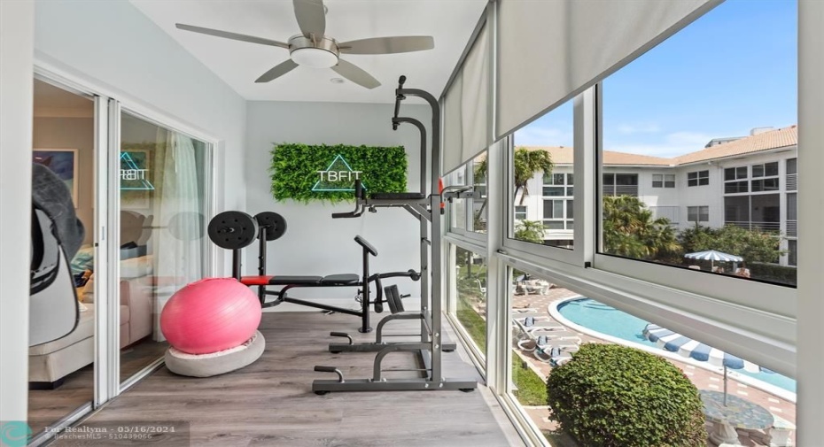 Enclosed Patio Overlooking the Pool and Garden Area