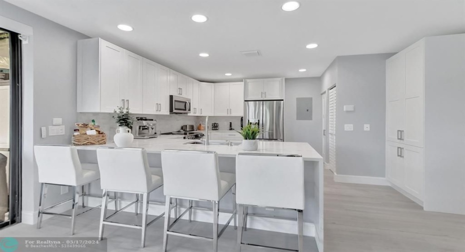 Kitchen counter bar allows ample dining space.