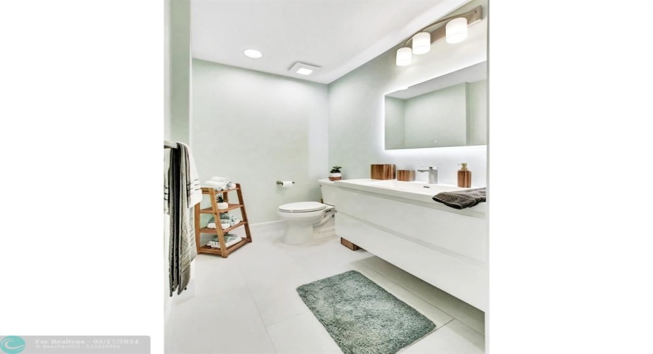 A clean line modern look gives this guest bath an inviting feel.