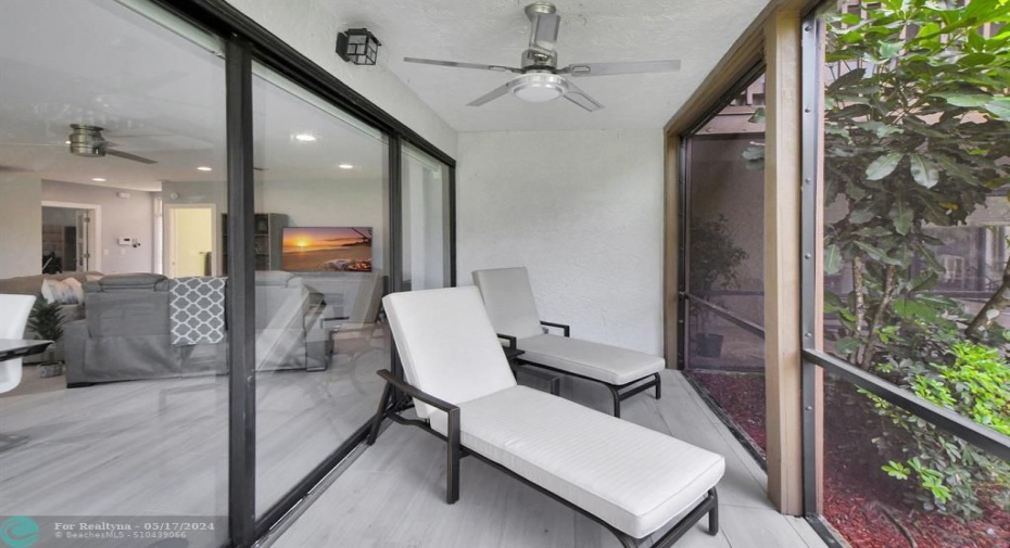 Wrap around screen enclosed patio provides additional living space.