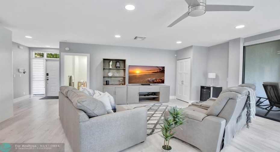 Foyer continues to bright open living space.