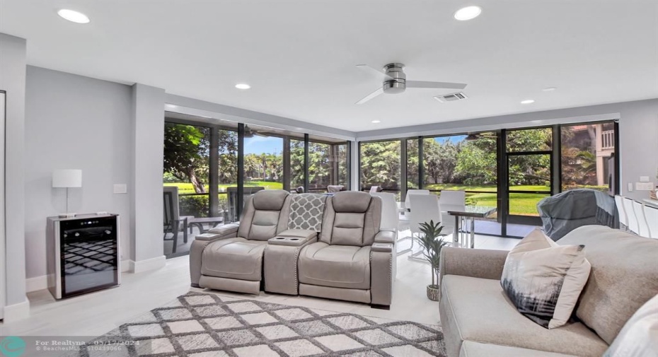 Recessed lighting & wood planked tile floors give this open space a modern feel.
