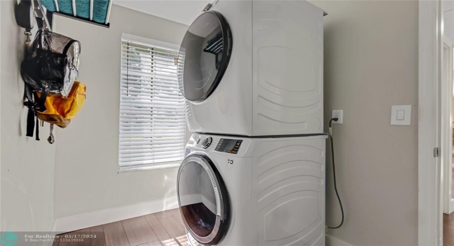 New front loaders in laundry room. leads to 2 car garage