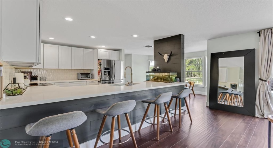 Incredible long counter leading from the family room