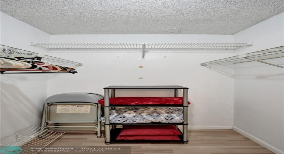 1st walk-in closet/primary bedroom.