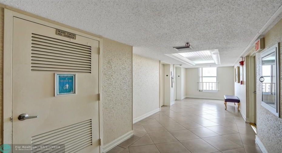 Garbage and elevator in close proximity to unit #1410.