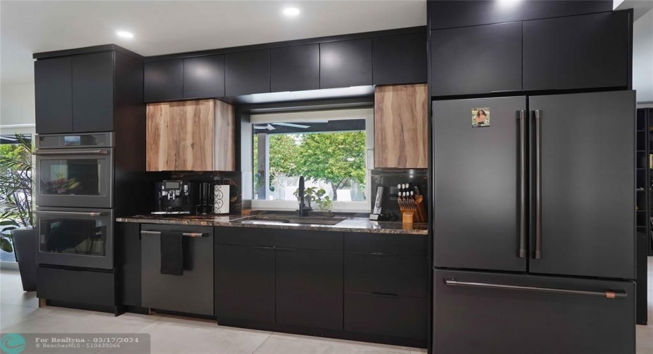 The appliances are top of the line GE Cafe stainless series in matte black.