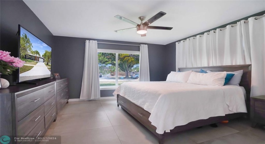 The primary bedroom is located on one side of the house, and the other 3 bedrooms are on the other side of the house.