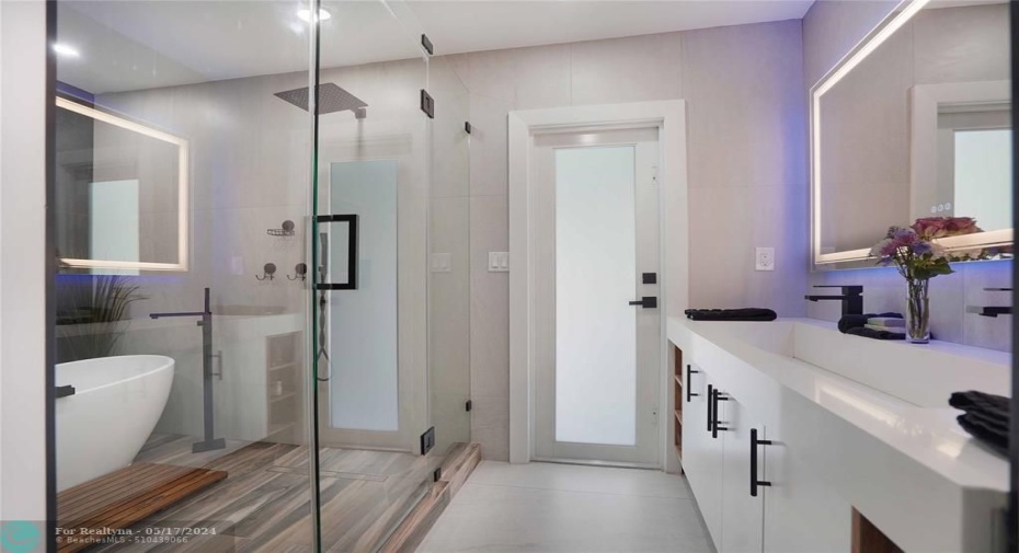 The primary bathroom has a beautiful spa like vibe.