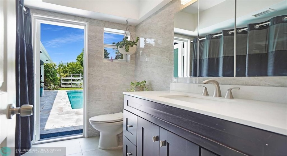 The second bedroom has a door that leads out to the pool.