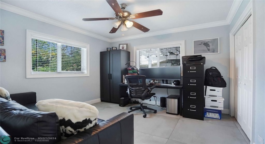 The third bedroom is being used as an office.