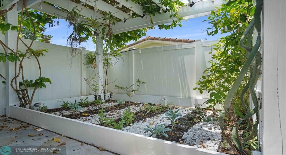 This garden area has a custom made pergola.