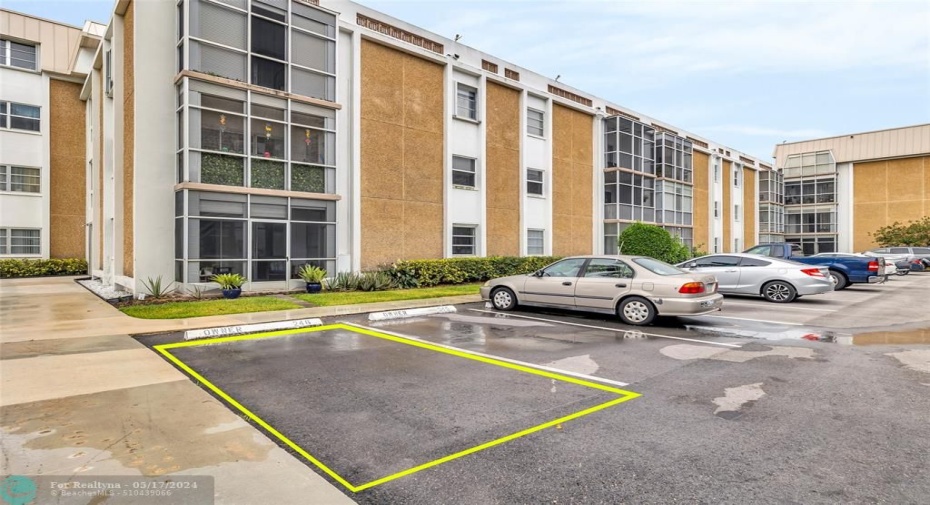 Corner parking spot near the building entrance.