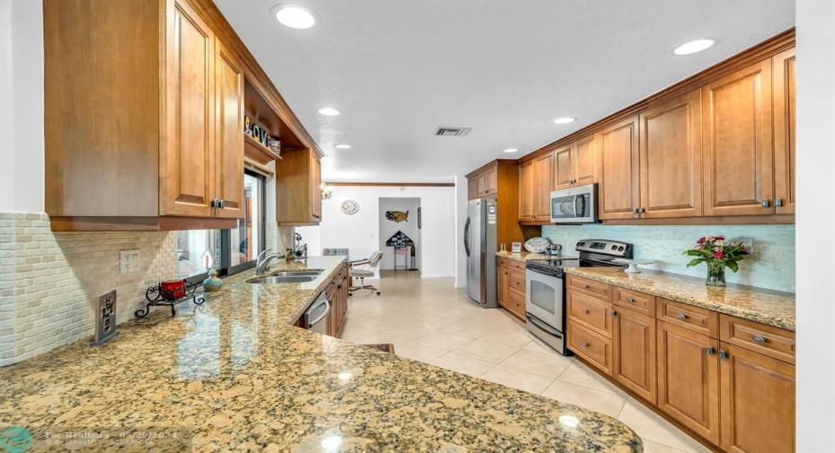 SNACK BAR BETWEEN KITCHEN AND FAMILY ROOM