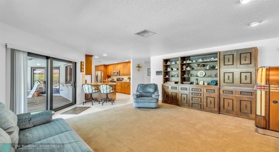 FAVORITE SPOT FOR HOMEOWNER-- SNACK BAR AT END OF KITCHEN COUNTER BETWEEN KITCHEN AND FAMILY ROOM