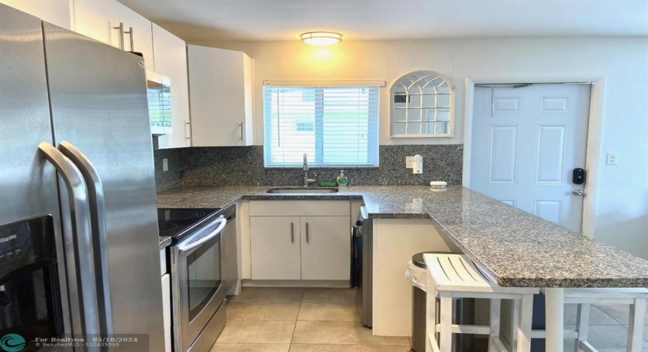 Updated kitchen with dishes & pots & pans