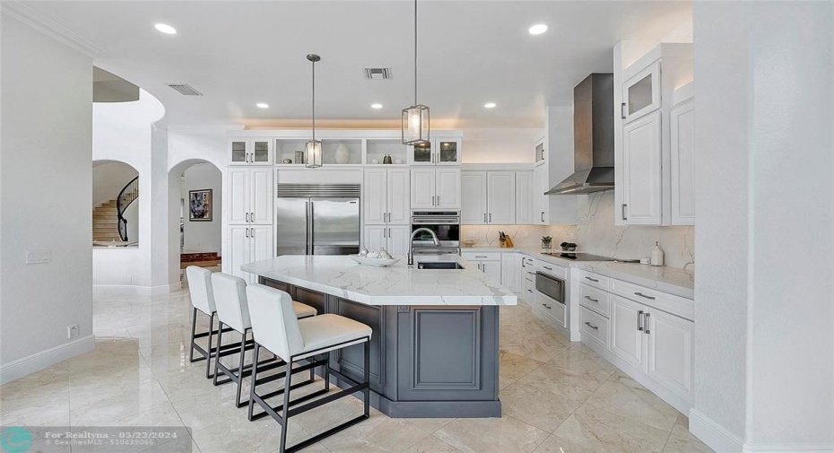 Chef's kitchen with lots of storage and pullouts great for entertaining guests as most people gather around and walk around the island with such a wide kitchen for wine and cheese entertaining,