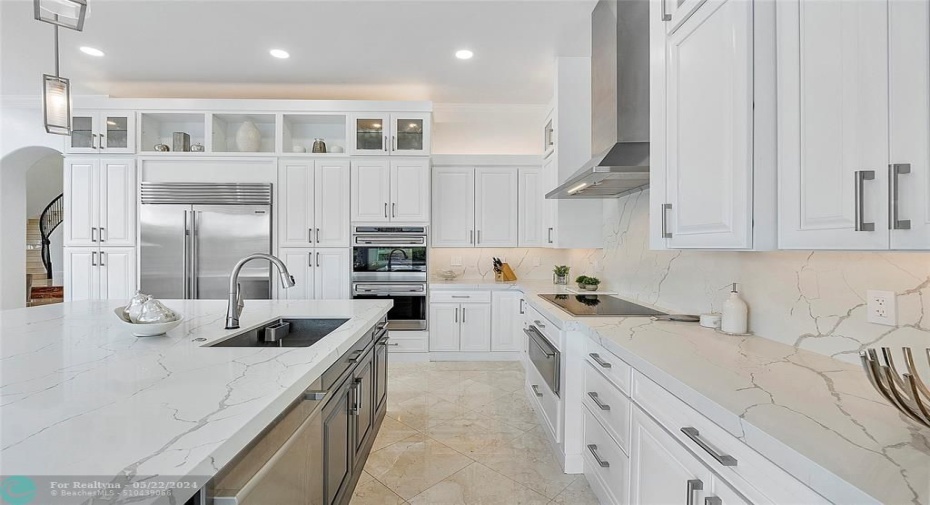 A side view of the 2 tone white and greige kitchen all remodeled