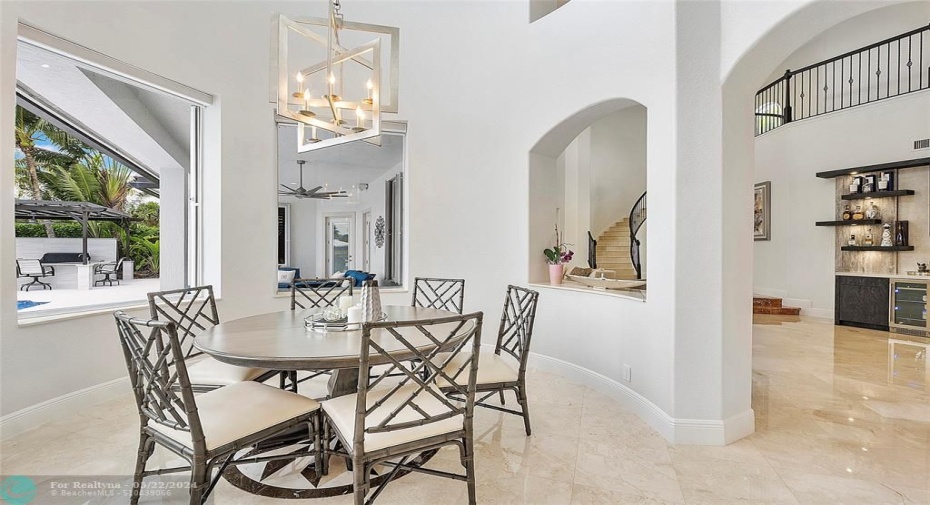 Eat-in dining area adjacent to the kitchen with circular tower all the way up for 2 story's 23 feet high
