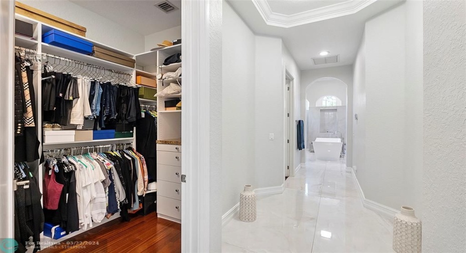 This is the hallway to the Master bathroom from the Master bedroom,Passby His and Hers closets and lots of space for clothing!