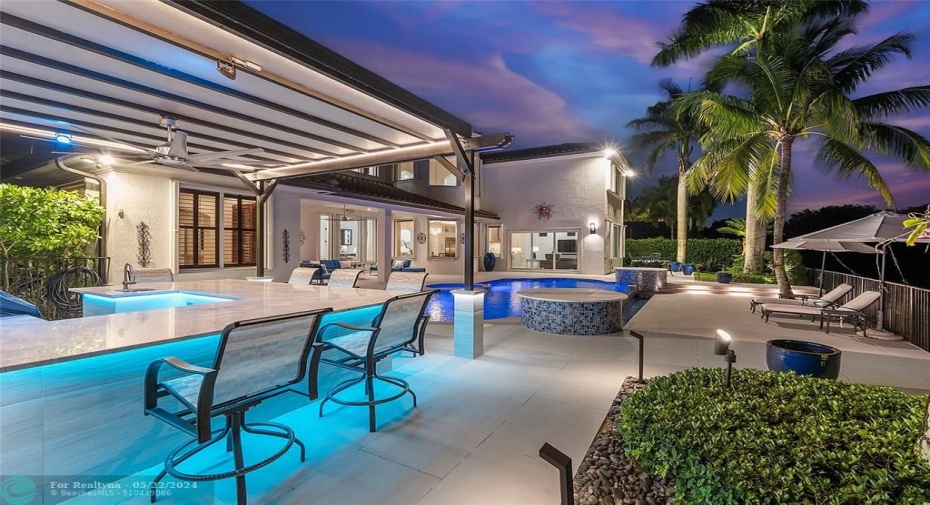 Nighttime view from the Pergola with underlighting bar and quartz countertop, great for inviting friends over for a cocktail to watch the sunset, look at the sky we have purple and orange skies most nights
