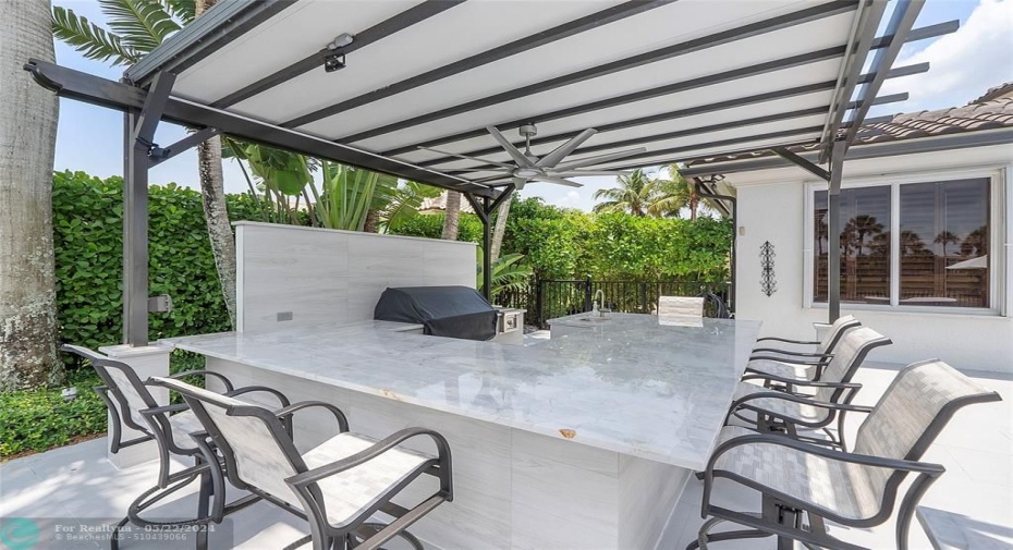 Pergola sheltered dining and entertaining we have a newer grill with side burner + refrigerator for a kool beer or glass of wine, This summer kitchen was installed & built-in 2022