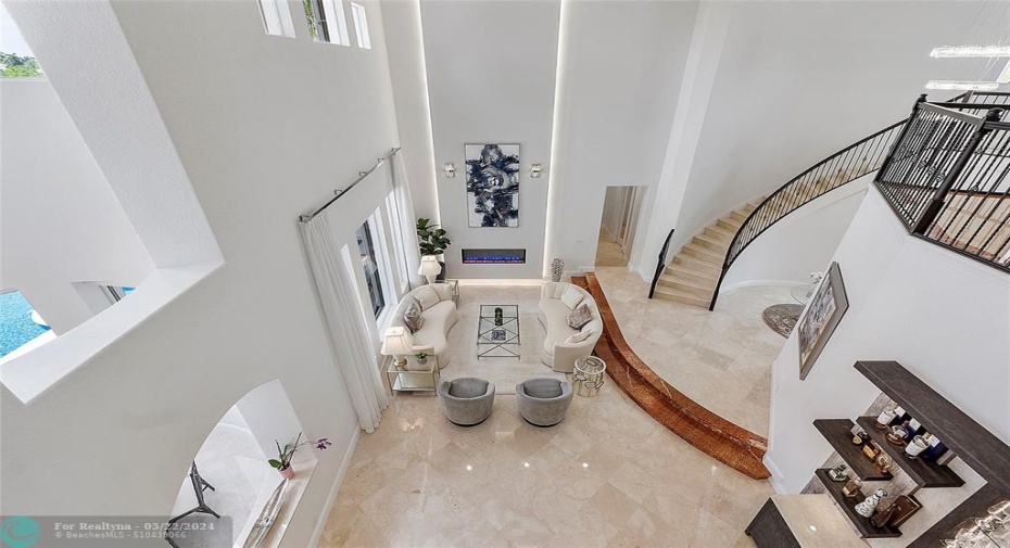 A view from the upstairs Balcony looking down onto the 2 story living area & staircase