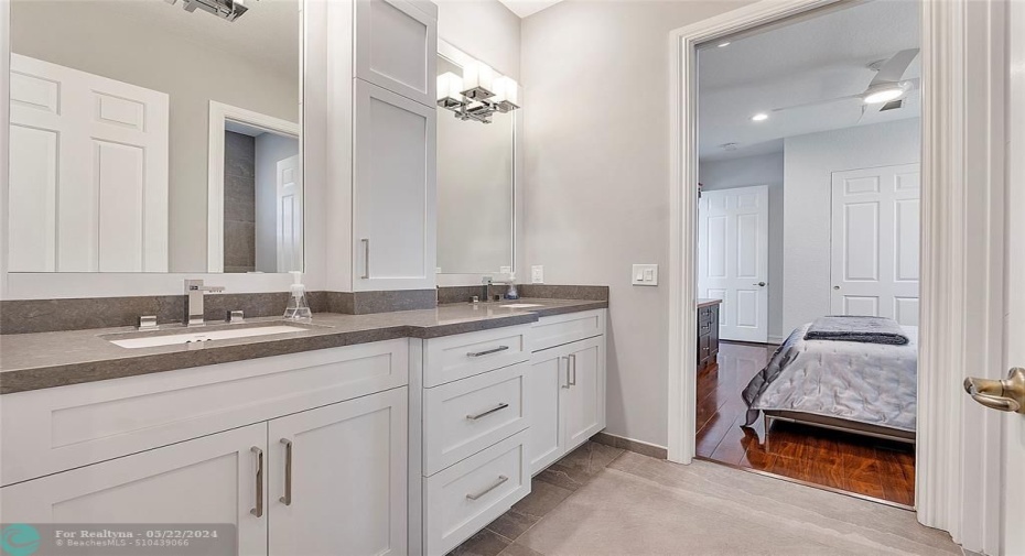 Modern full bathroom looking into the 3rd bedroom that is upstairs